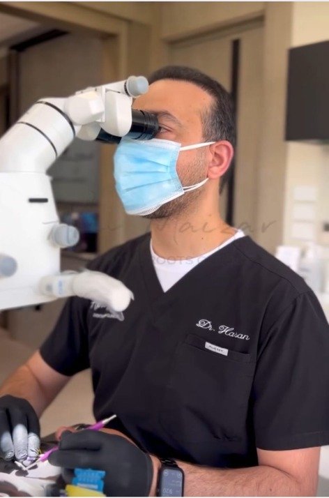 Dr. Hasan AbuMaizar utilizes a dental microscope to provide precise and minimally invasive treatments, ensuring the highest standards of care and optimal results for every patient.